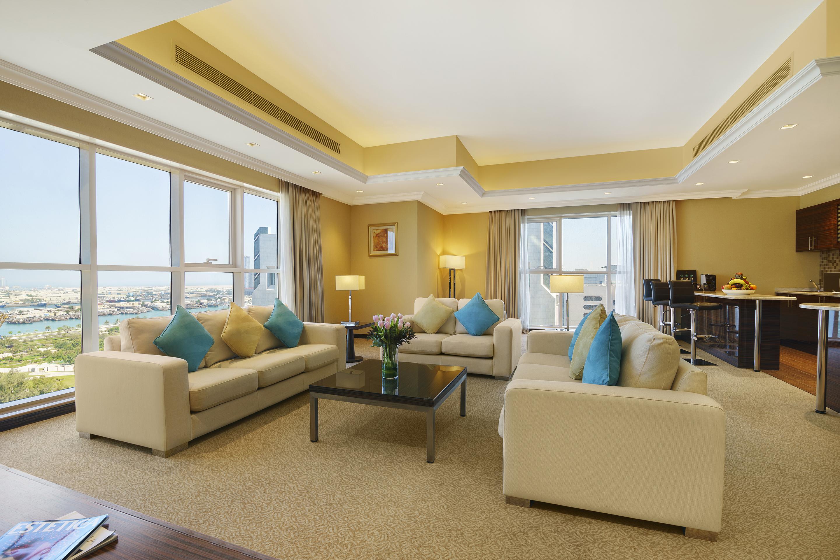 Jannah Burj Al Sarab Hotel Abu Dhabi Exterior foto A living room in a suite at the hotel