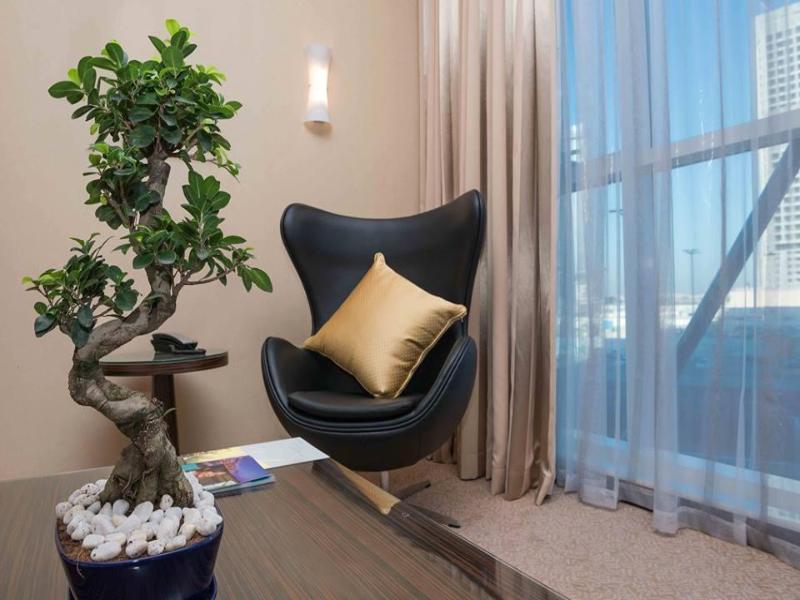 Jannah Burj Al Sarab Hotel Abu Dhabi Exterior foto Ficus benjamina in a home