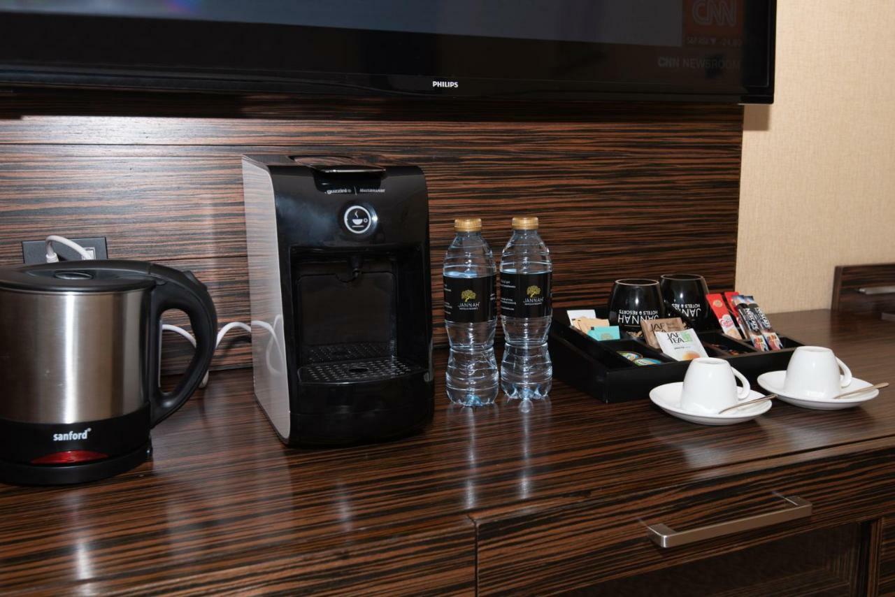 Jannah Burj Al Sarab Hotel Abu Dhabi Exterior foto A Nespresso machine in a hotel room